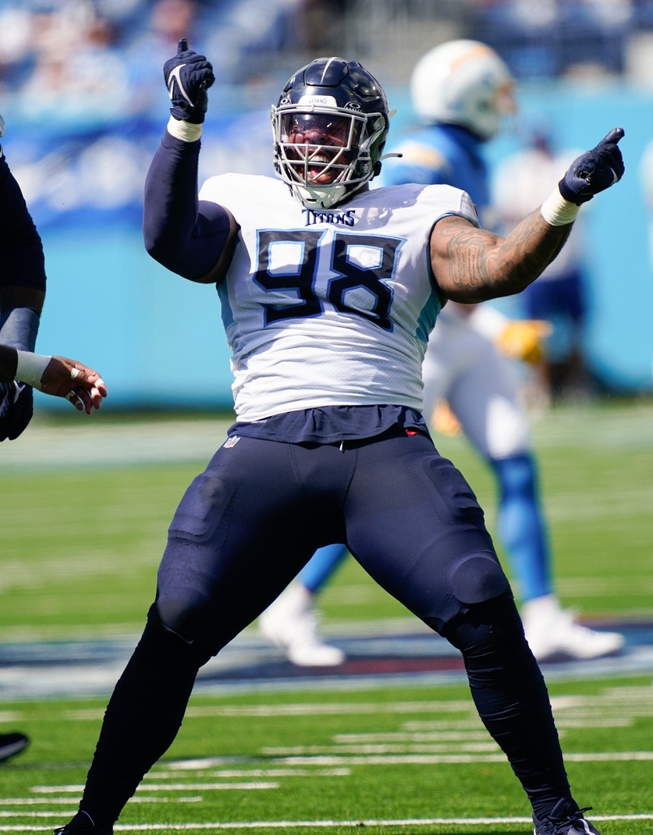 Titans defensive tackle Jeffery Simmons (98) celebrates after sacking Los Angeles Chargers quarterback Justin Herbert (10).